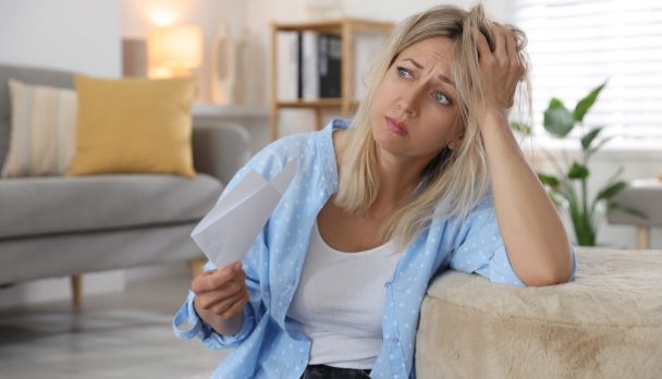 Menopause.,Woman,Waving,Paper,Sheet,To,Cool,Herself,During,Hot