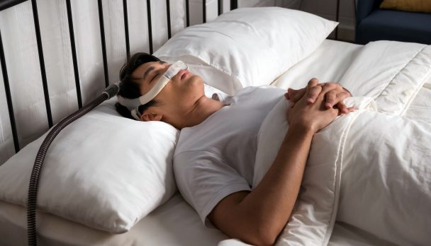 Asian,Man,Sleeping,Calmly,With,Cpap,Nasal,Mask,In,Bed,