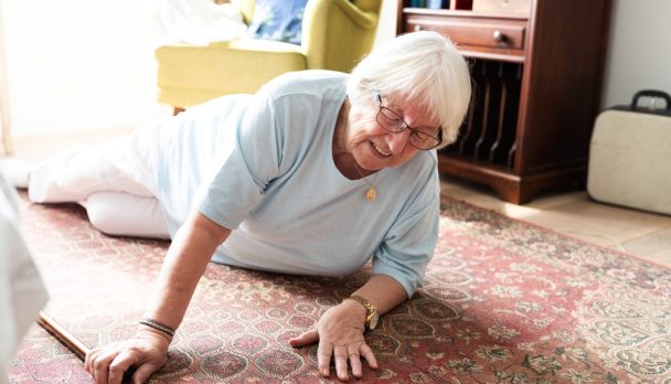 Elderly,Woman,On,The,Floor,,Reaching,For,Help.,Senior,Woman